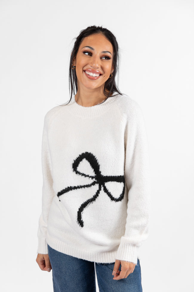 Feeling Like Love Ivory and Black Bow Crew Neck Sweater Explore